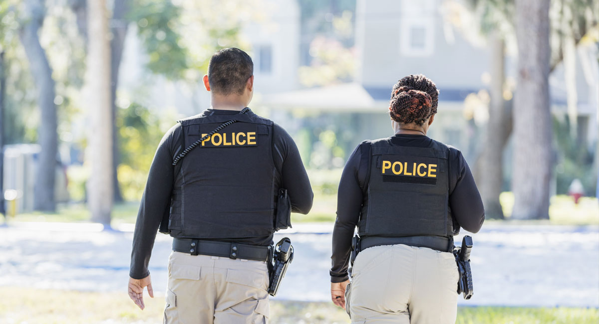 man and woman police officers walking